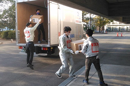 Participating in a drill to deliver relief goods with a local government